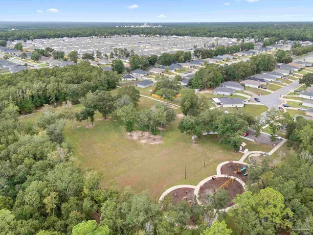 an aerial view of a house with a lake view