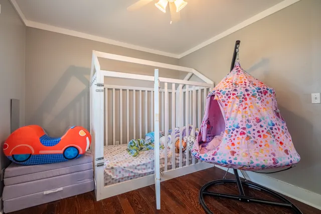 a room with lots of stuff and hardwood floor