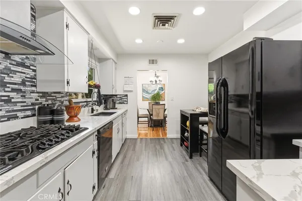 a kitchen with a sink and a stove