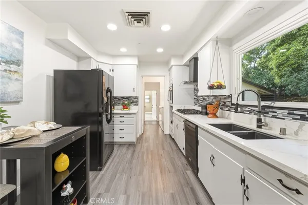 a living room with furniture and windows