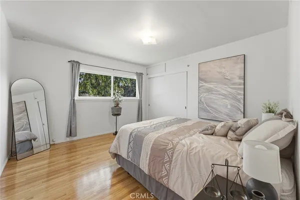 a living room with furniture a rug and a large window