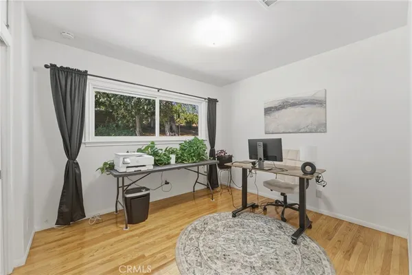 a bathroom with a toilet sink a mirror and vanity