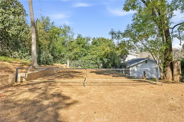 a view of a house with a snow in the yard
