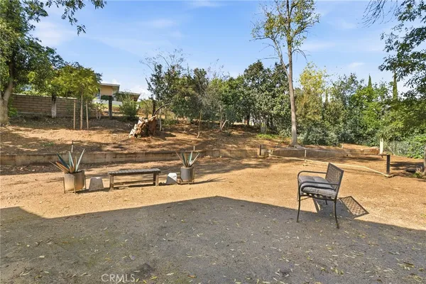 a view of a backyard with sitting area