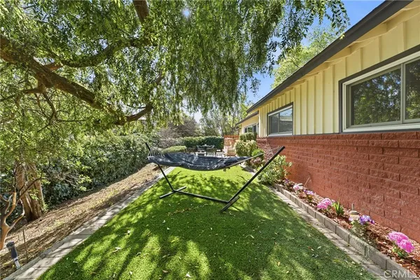 a backyard of a house with lots of green space