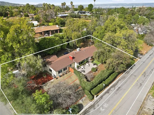 a view of a balcony with a forest
