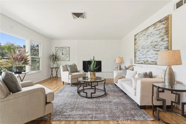 a living room with furniture or couch and a large window