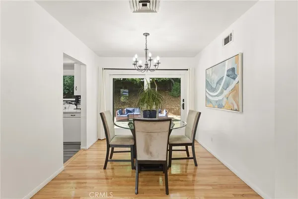 a kitchen with stainless steel appliances granite countertop a stove and a refrigerator