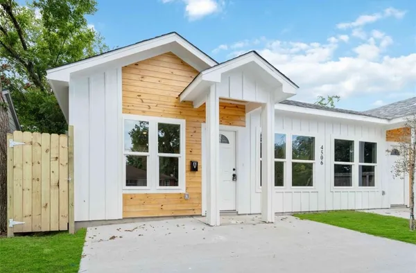 a view of front door of house with yard