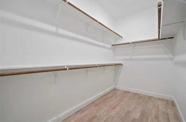 a view of an empty walk in closet