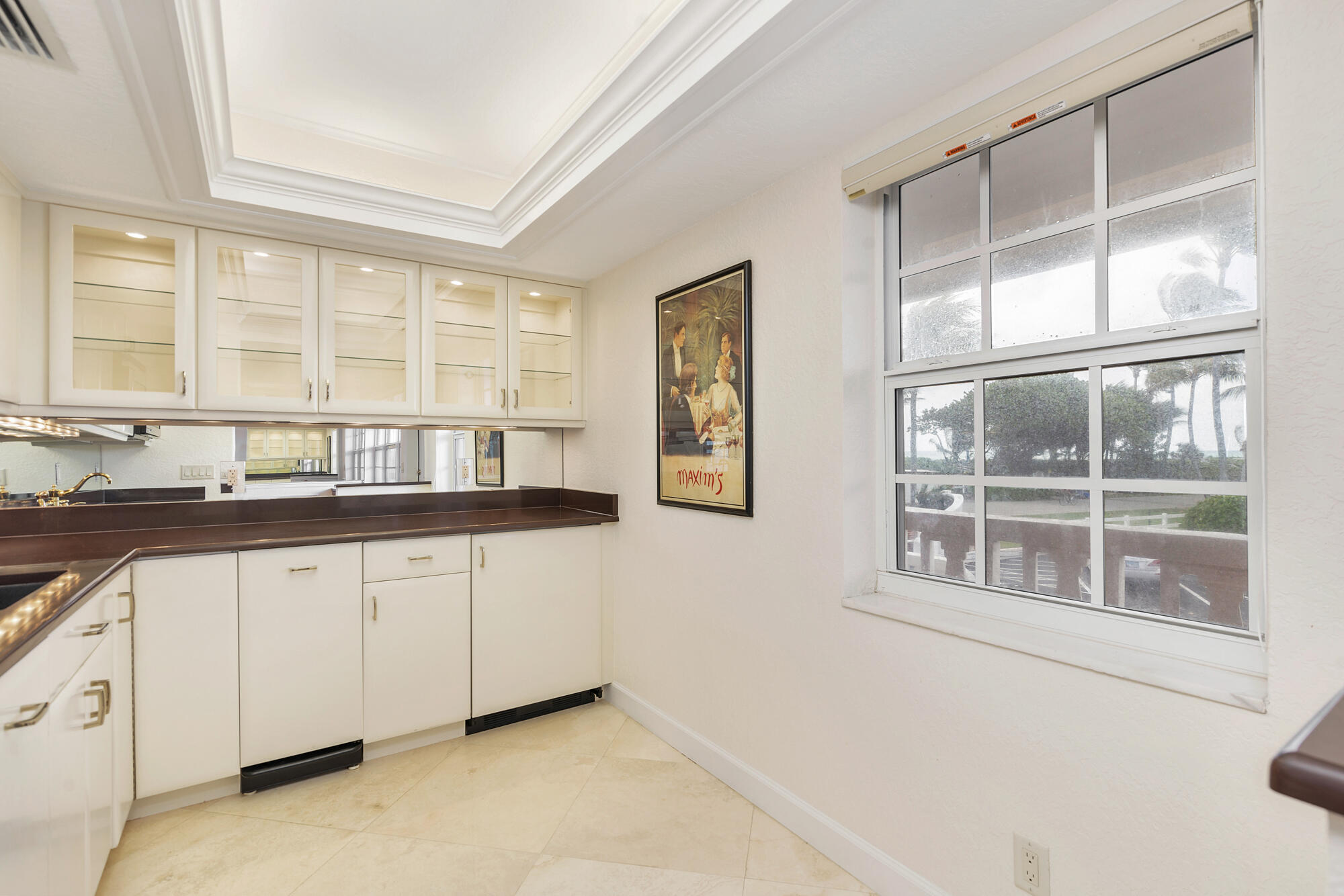 5505 North Ocean Boulevard, Unit 15204 Ocean Ridge, FL 33435 - Photo 11 of 34 a kitchen with granite countertop a stove and a sink