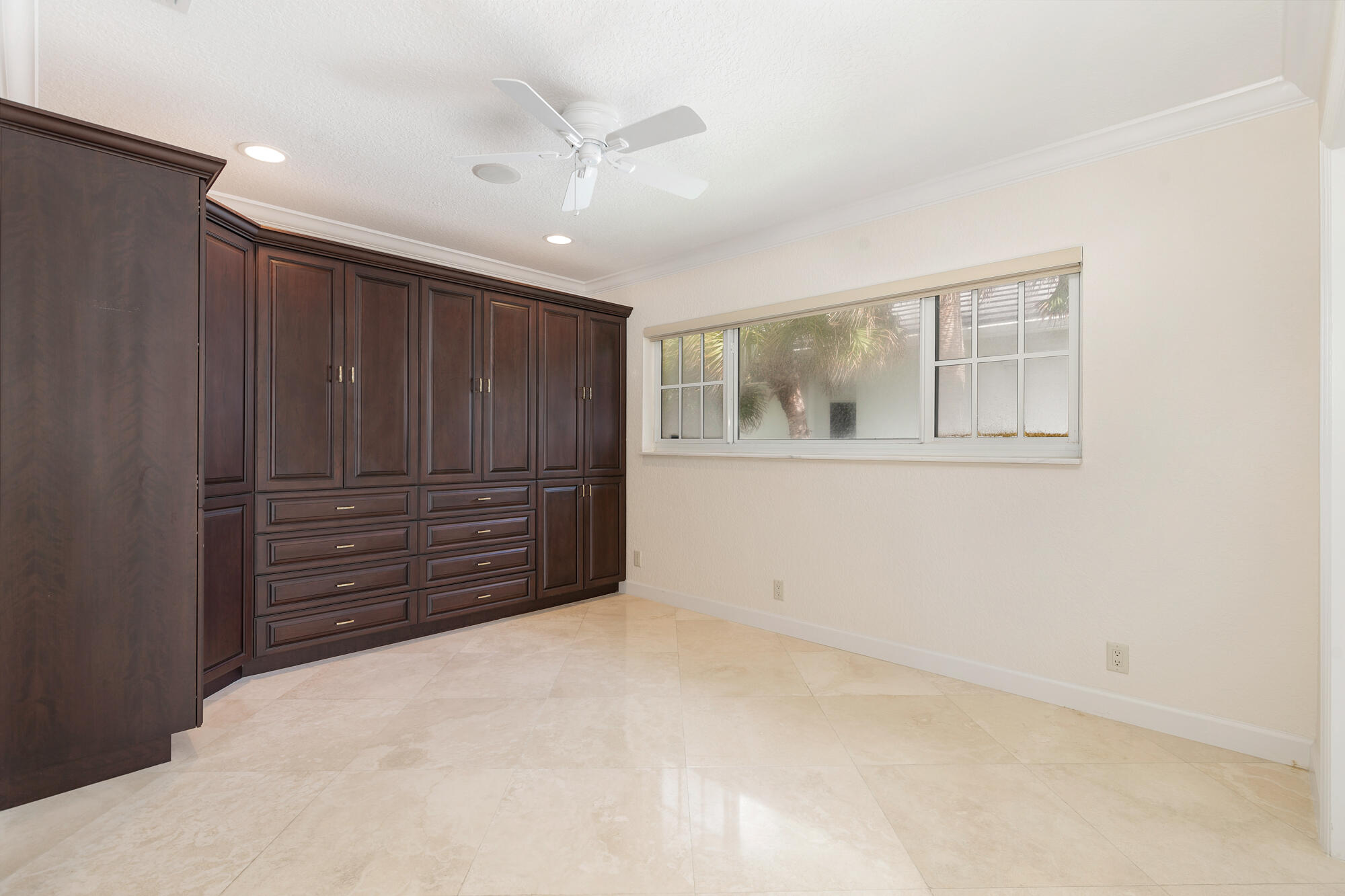 5505 North Ocean Boulevard, Unit 15204 Ocean Ridge, FL 33435 - Photo 14 of 34 a view of an empty room with cabinet and a window