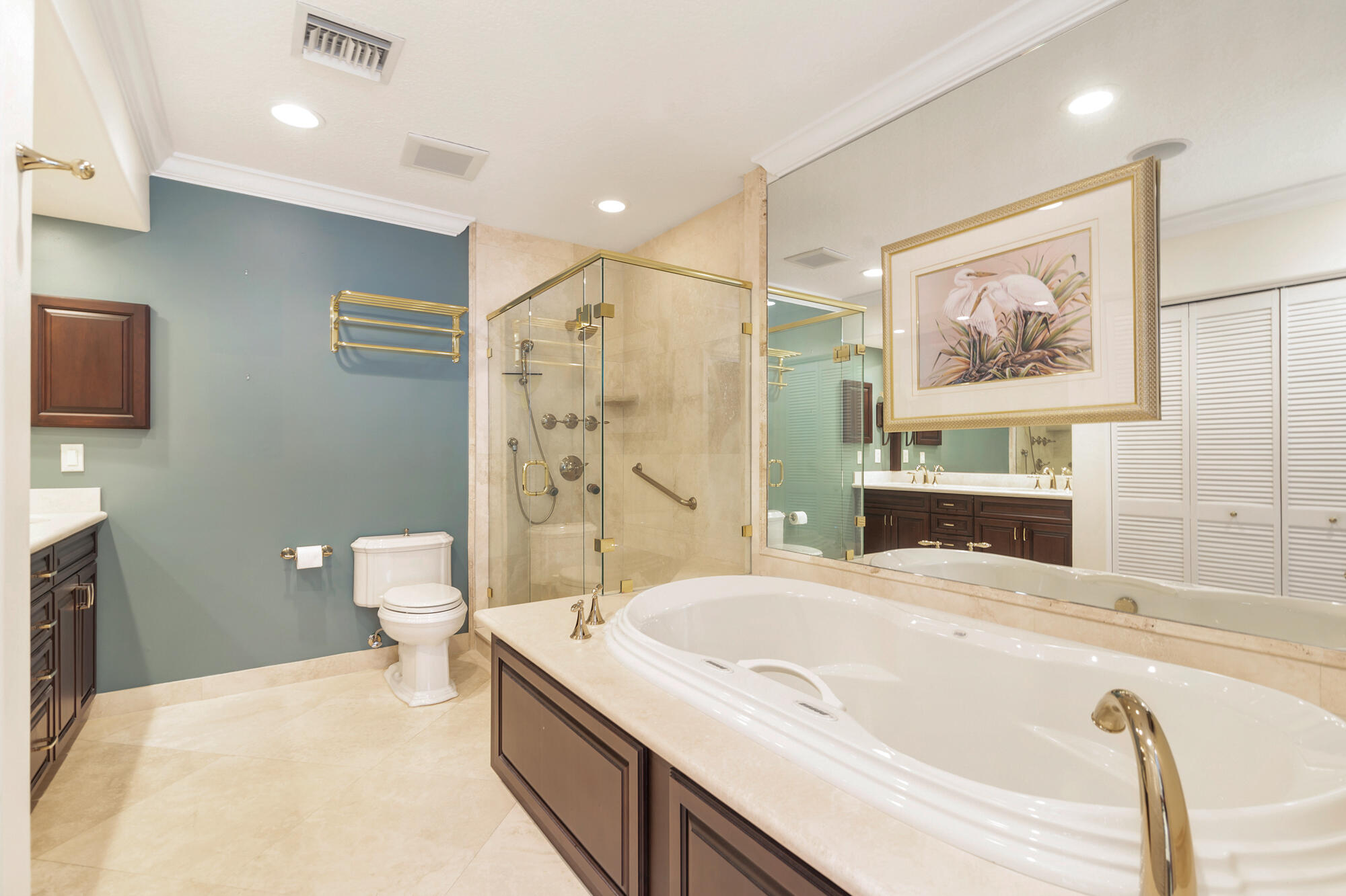 5505 North Ocean Boulevard, Unit 15204 Ocean Ridge, FL 33435 - Photo 16 of 34 a bathroom with a tub sink toilet and mirror