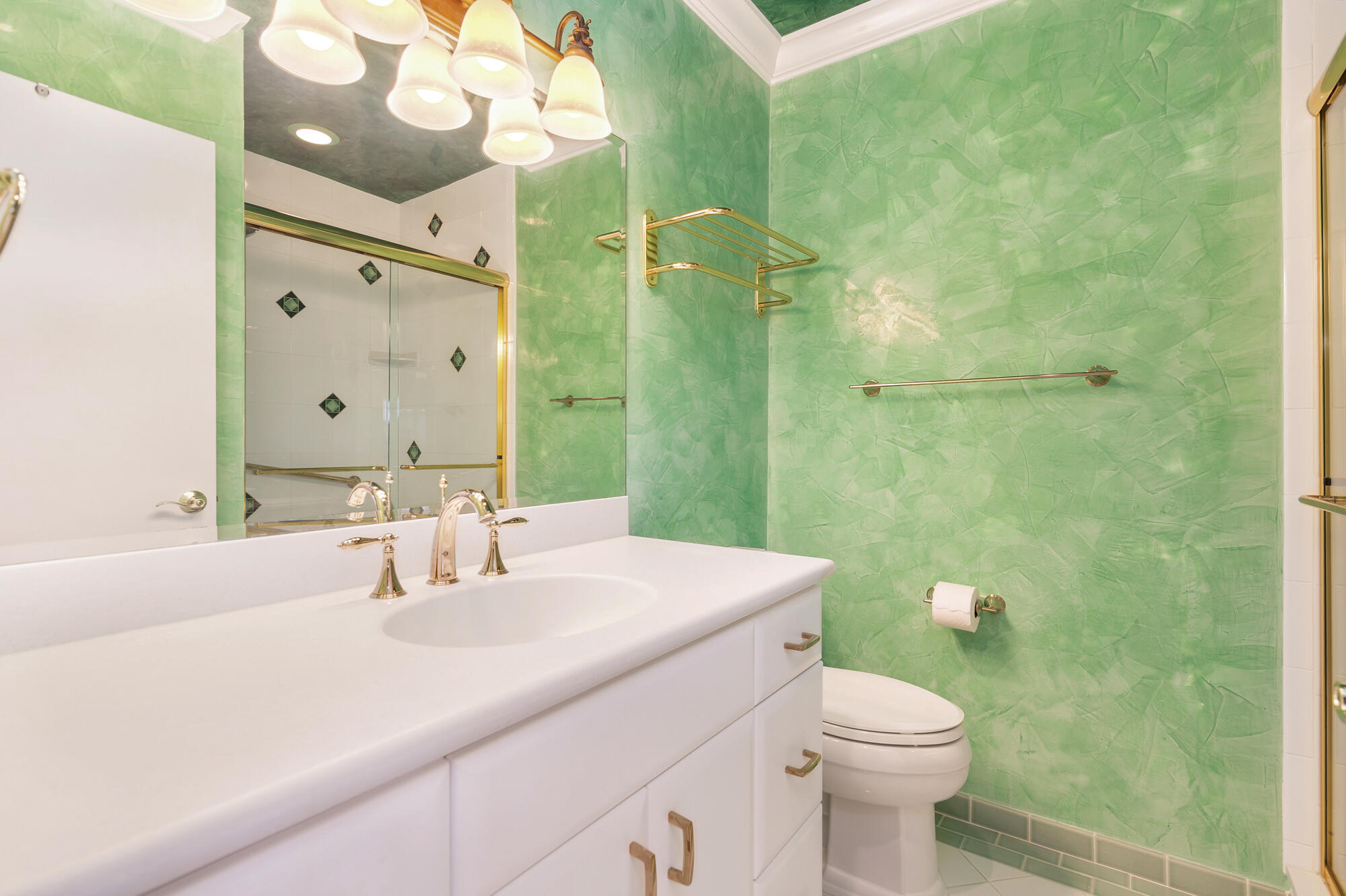 5505 North Ocean Boulevard, Unit 15204 Ocean Ridge, FL 33435 - Photo 19 of 34 a bathroom with a sink a toilet and shower