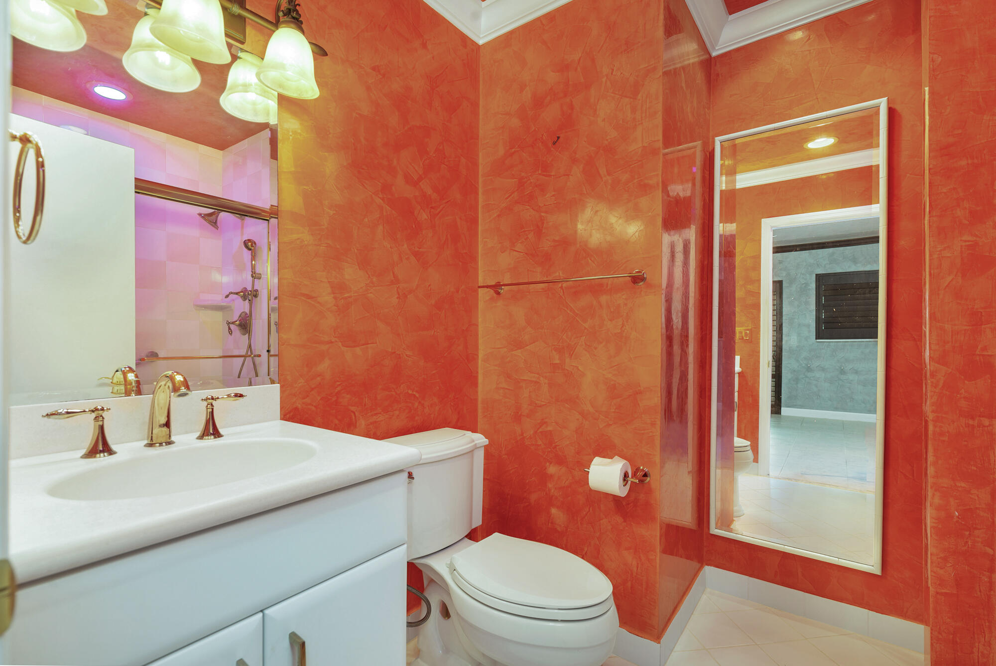 5505 North Ocean Boulevard, Unit 15204 Ocean Ridge, FL 33435 - Photo 21 of 34 a bathroom with a sink a toilet a mirror and shower