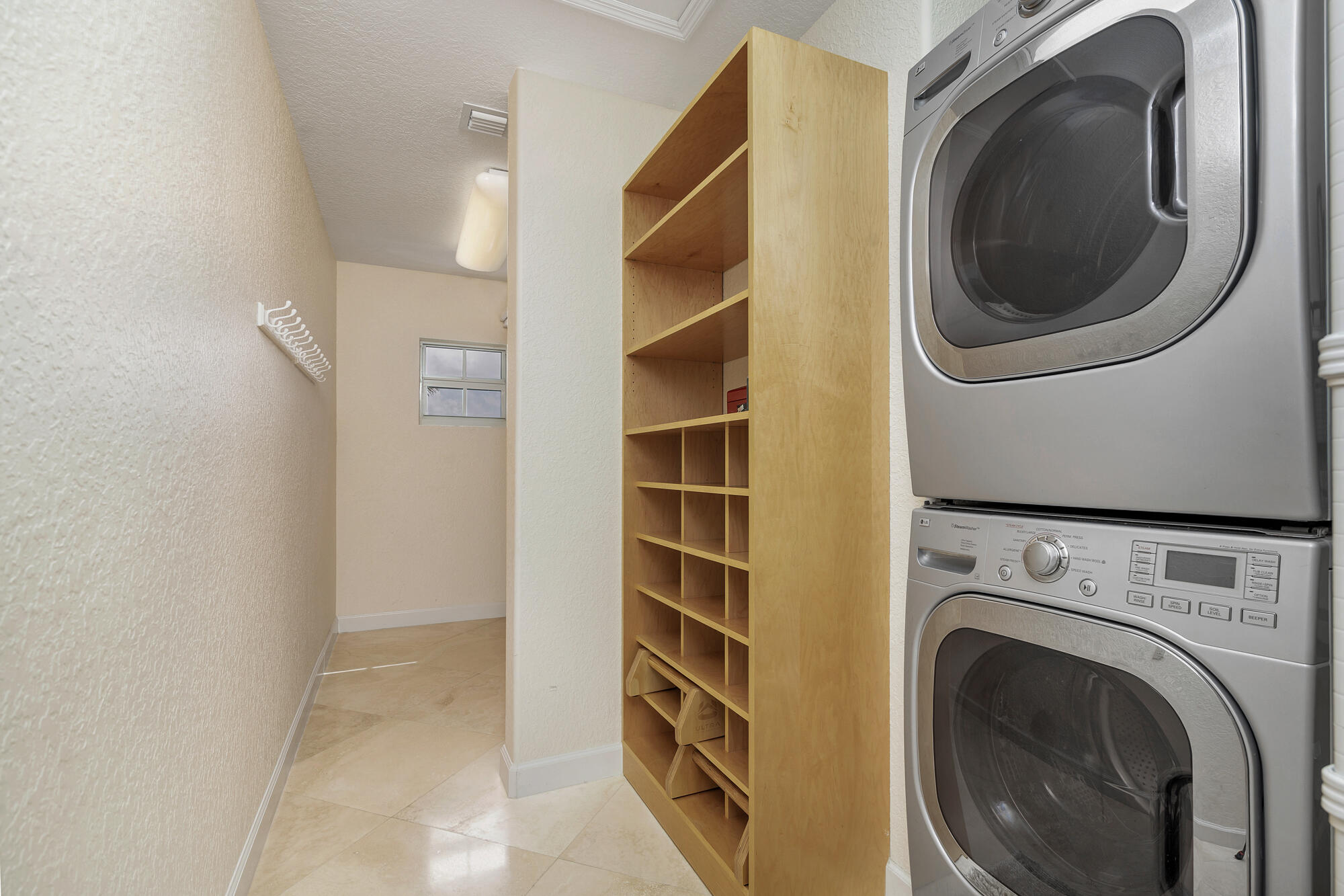 5505 North Ocean Boulevard, Unit 15204 Ocean Ridge, FL 33435 - Photo 23 of 34 a view of a storage & utility room with washer and dryer