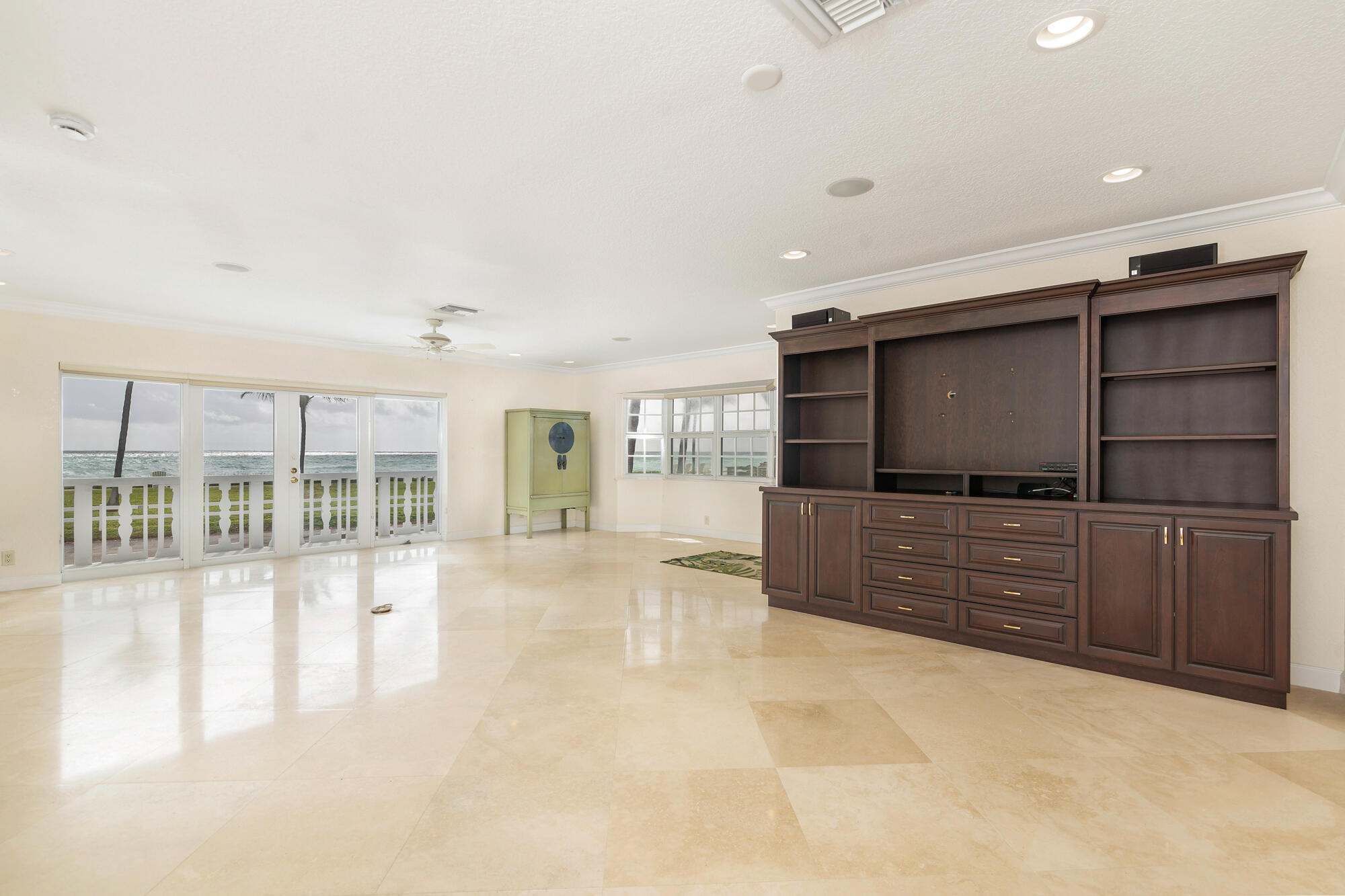 5505 North Ocean Boulevard, Unit 15204 Ocean Ridge, FL 33435 - Photo 6 of 34 a living room with furniture and a flat screen tv