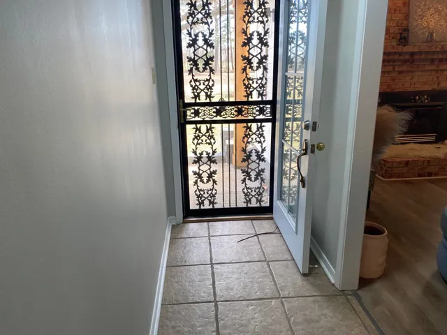 a view of entryway with a fireplace