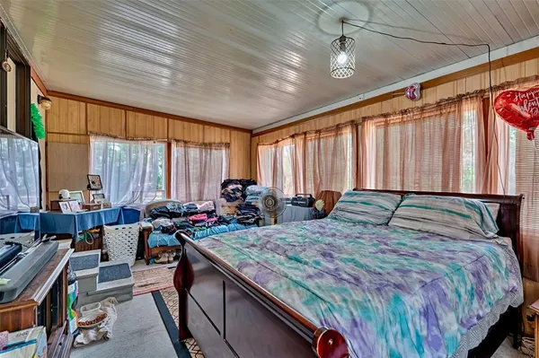 a bed room with a bed and a couch