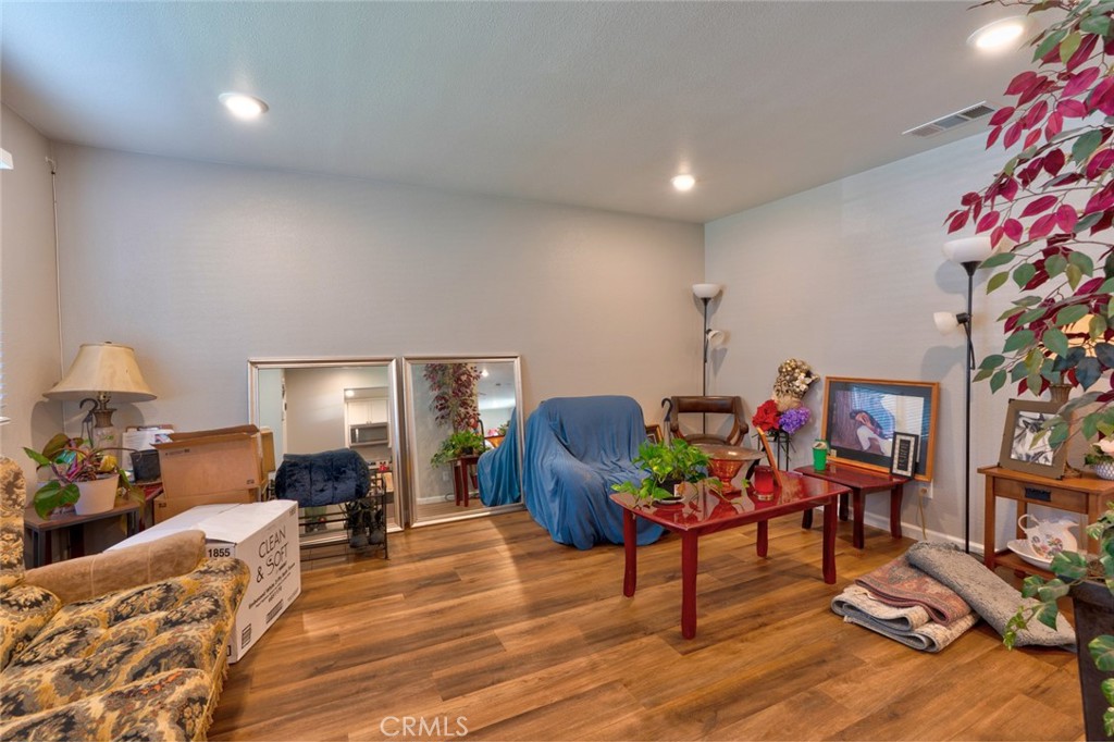 1840 Cheyenne Drive Merced, CA 95348 - Photo 15 of 90 a living room with furniture and a potted plant