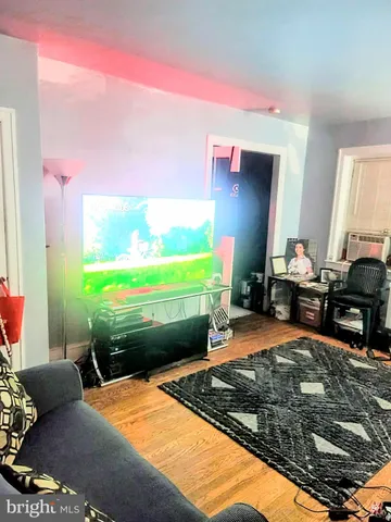 a room with furniture and a flat screen tv