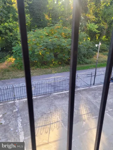 a view of a yard from a balcony