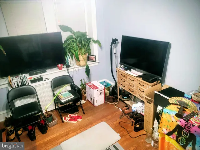 a room with furniture and a flat screen tv