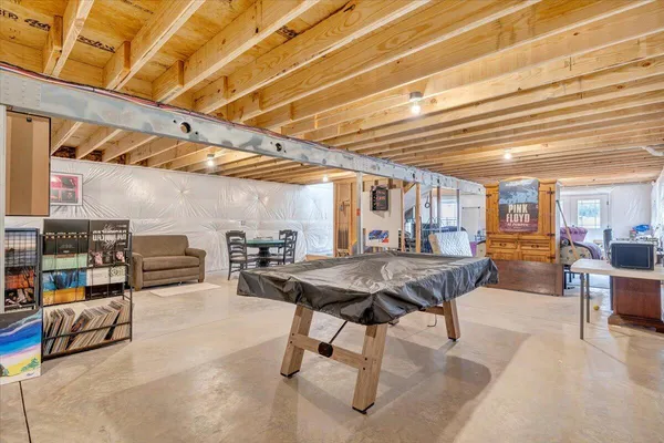 a view of a livingroom with furniture and a table