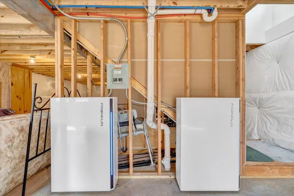 a view of a room with wooden floor and windows