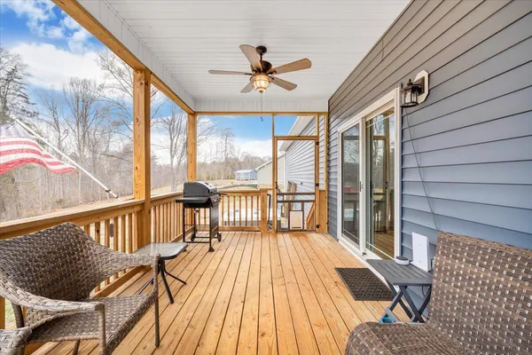 a view of balcony with wooden floor