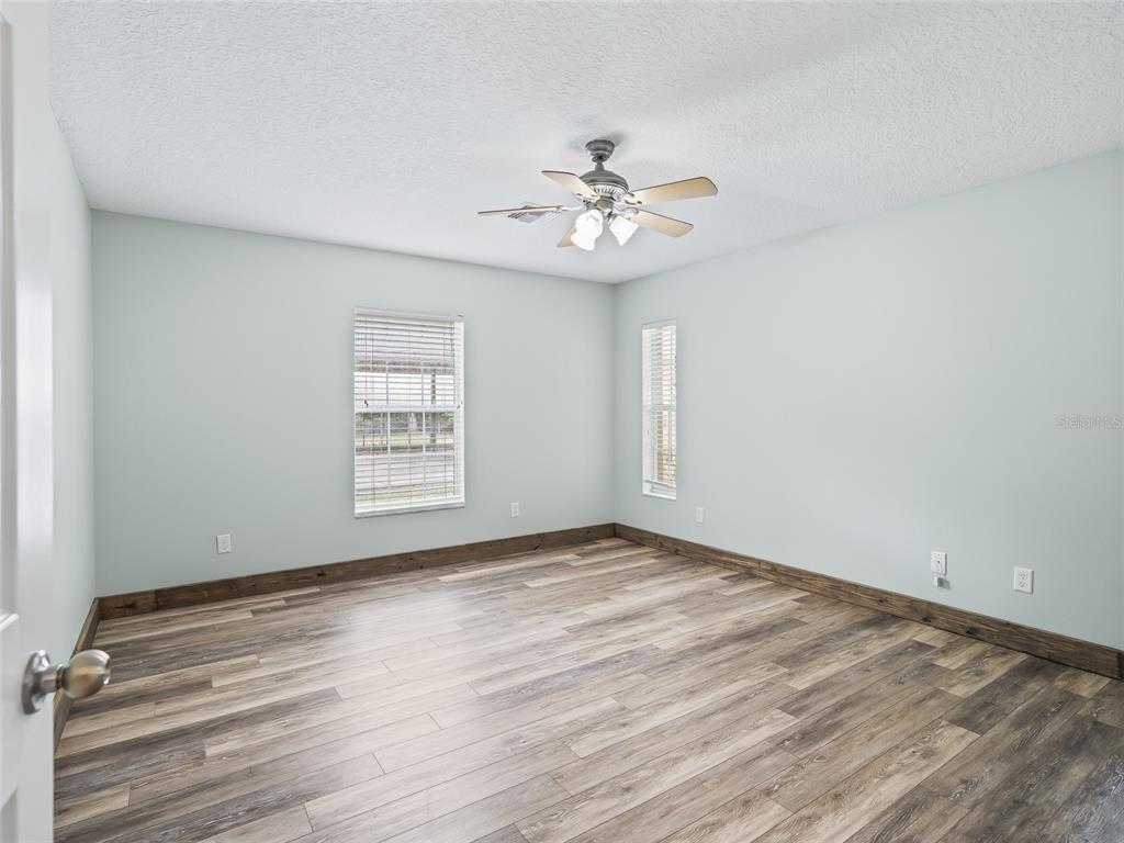 8234 Highway 301 Bushnell, FL 33513 - Photo 14 of 52 a view of an empty room with a window