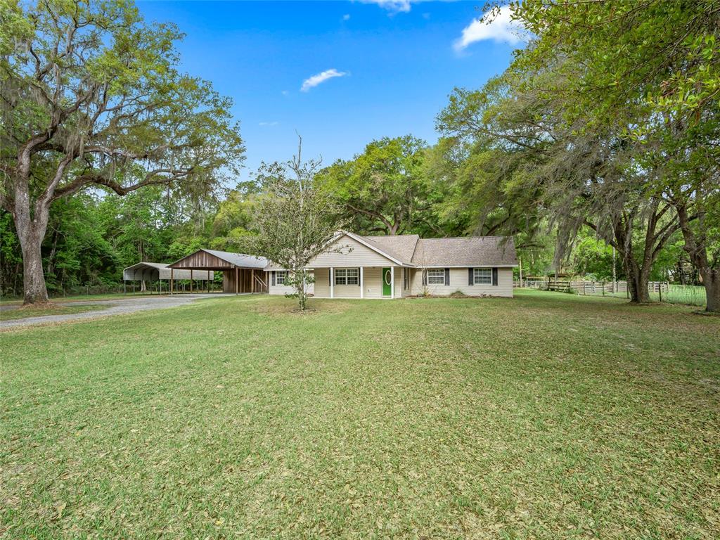 8234 Highway 301 Bushnell, FL 33513 - Photo 2 of 52 a view of a house with a big yard