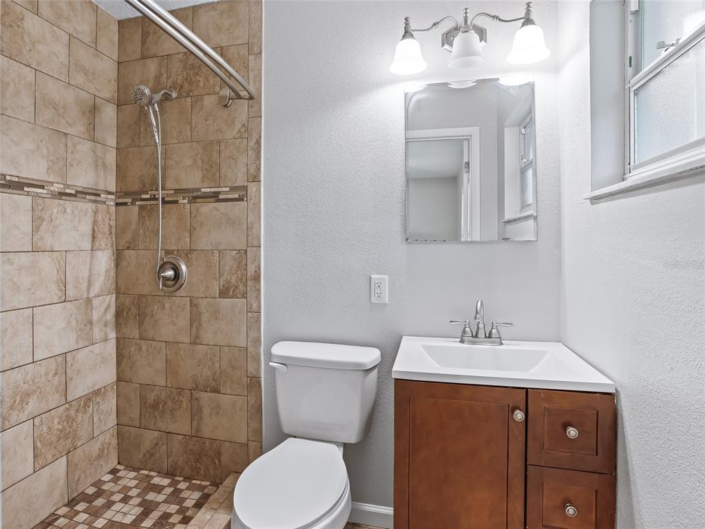 8234 Highway 301 Bushnell, FL 33513 - Photo 22 of 52 a bathroom with a sink toilet and shower