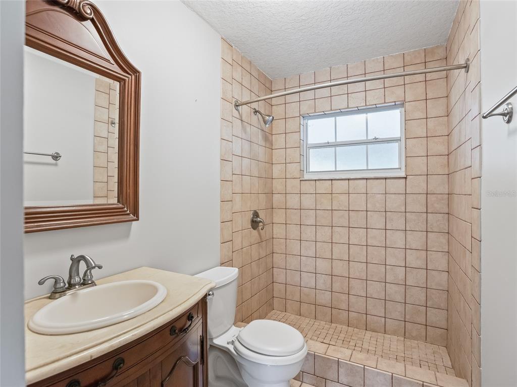 8234 Highway 301 Bushnell, FL 33513 - Photo 25 of 52 a bathroom with a sink a toilet and shower