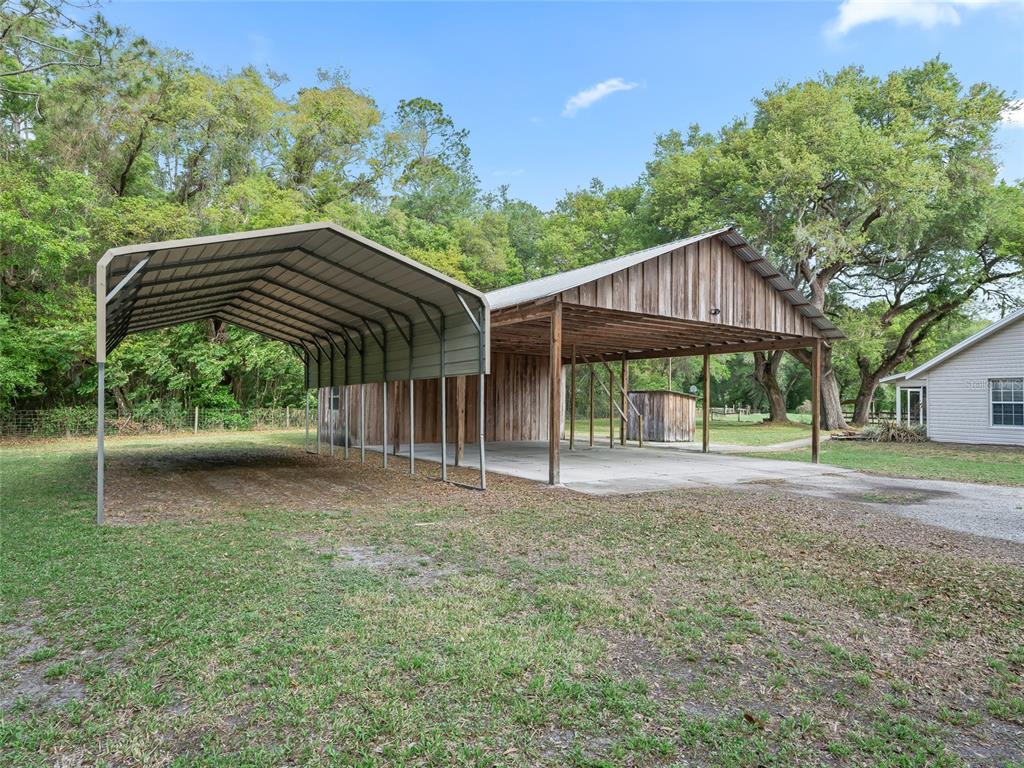 8234 Highway 301 Bushnell, FL 33513 - Photo 38 of 52 a view of a house with a yard