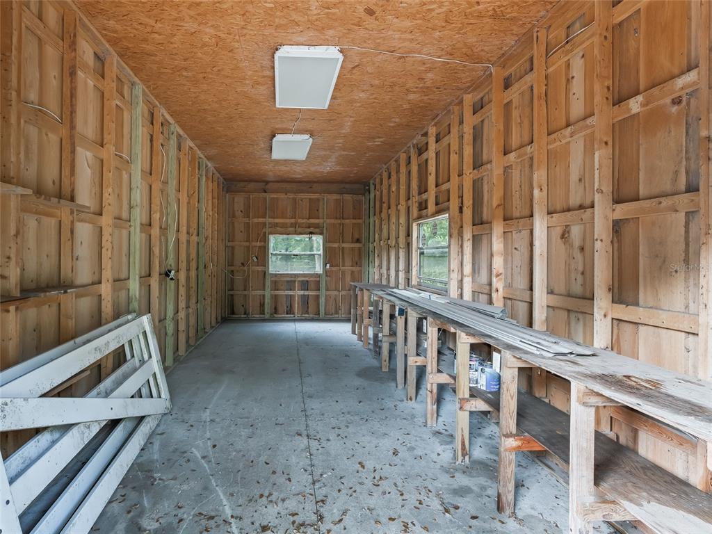 8234 Highway 301 Bushnell, FL 33513 - Photo 40 of 52 a view of a porch with wooden floor and stairs