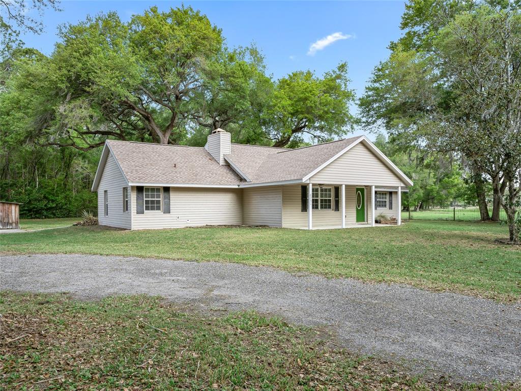 8234 Highway 301 Bushnell, FL 33513 - Photo 49 of 52 a front of a house with a yard