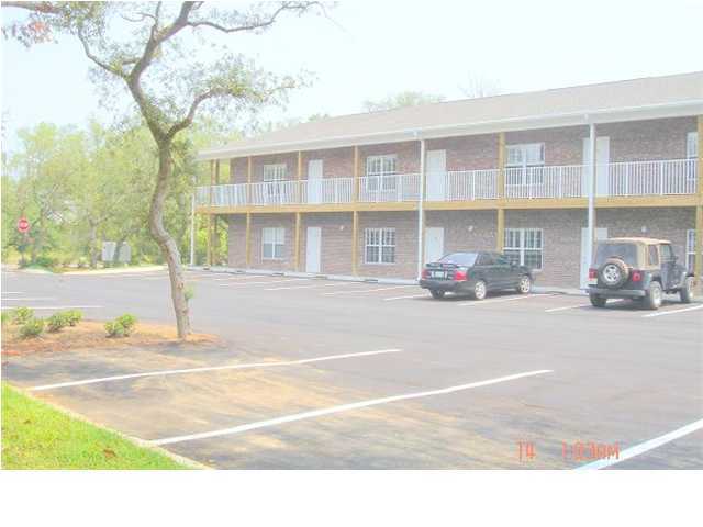 940 Barrow Street, Unit 1 Fort Walton Beach, FL 32547 - Photo 2 of 8 a car parked in front of a building