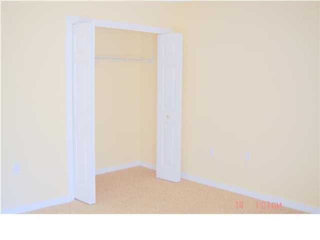 940 Barrow Street, Unit 1 Fort Walton Beach, FL 32547 - Photo 8 of 8 a room with a bench