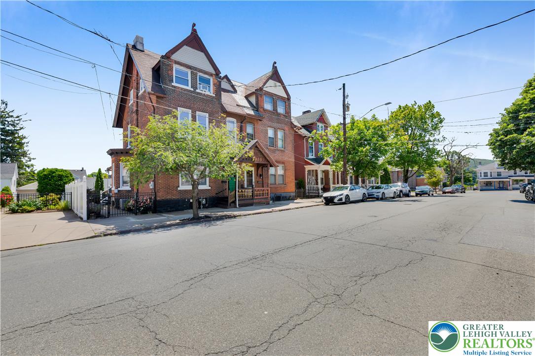 a view of a street with a building in the background