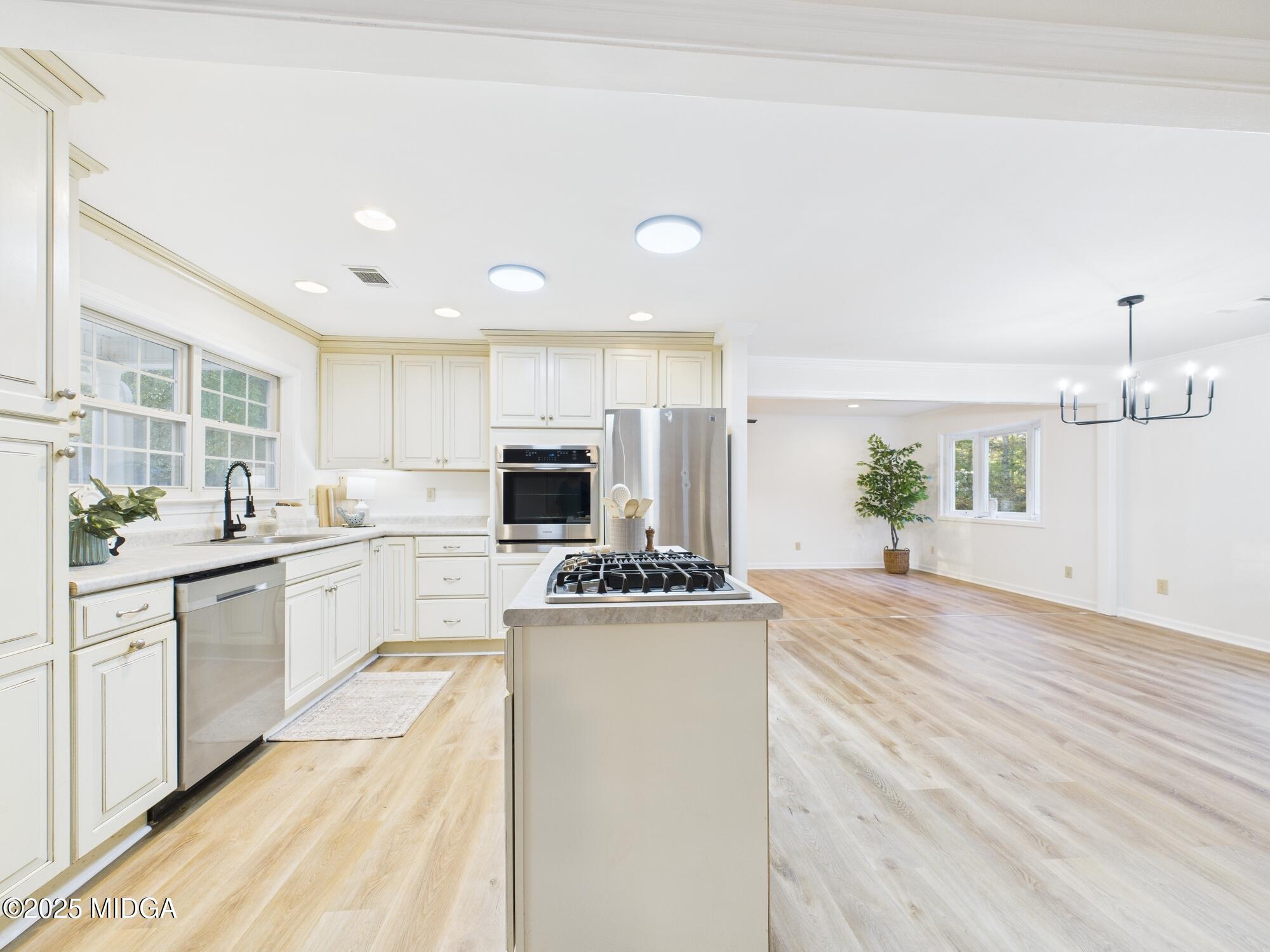 331 Marjane Drive Macon, GA 31210 - Photo 11 of 43 a kitchen with a sink stove and cabinets