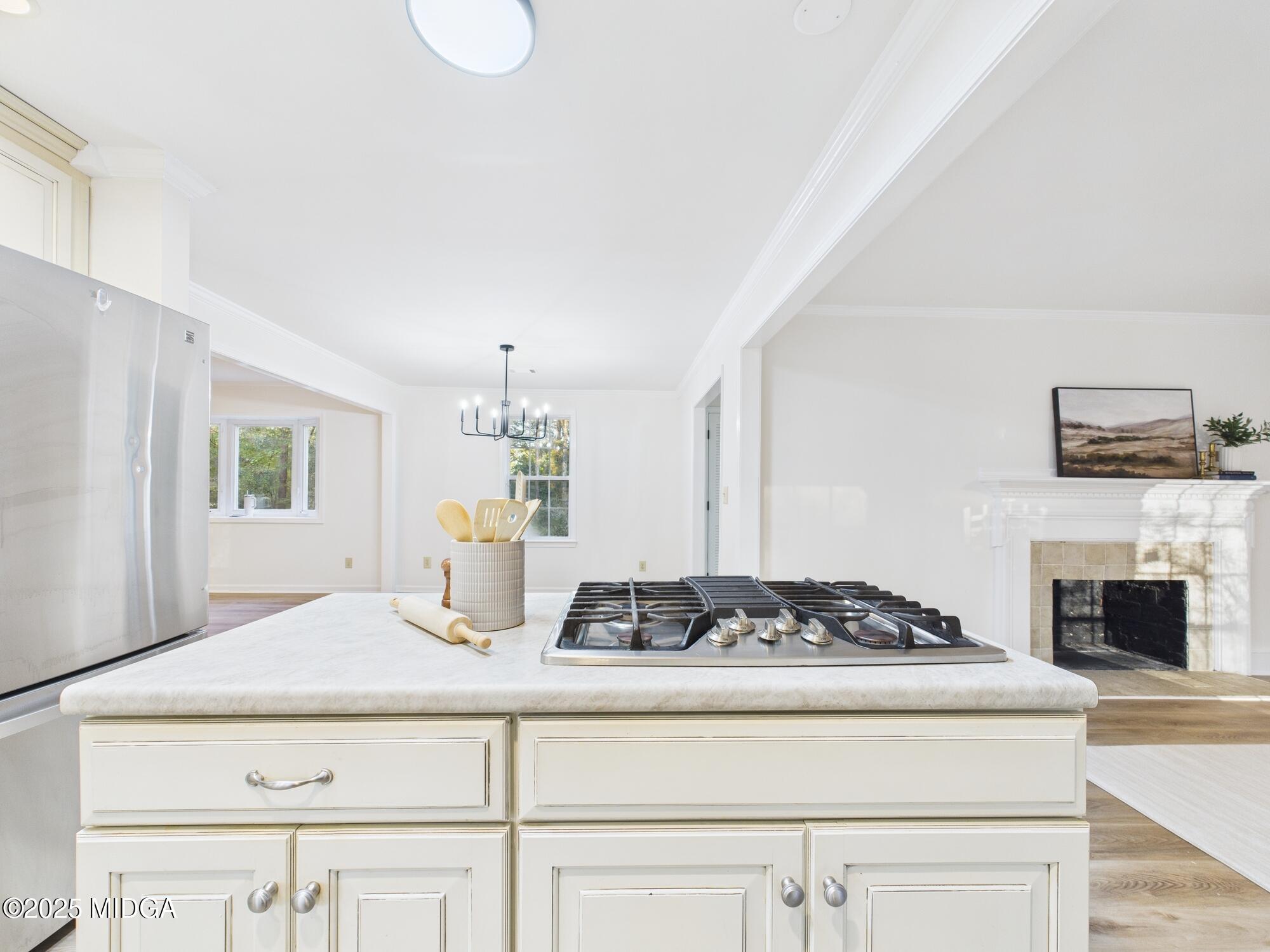 331 Marjane Drive Macon, GA 31210 - Photo 13 of 43 a kitchen with a stove and white cabinets