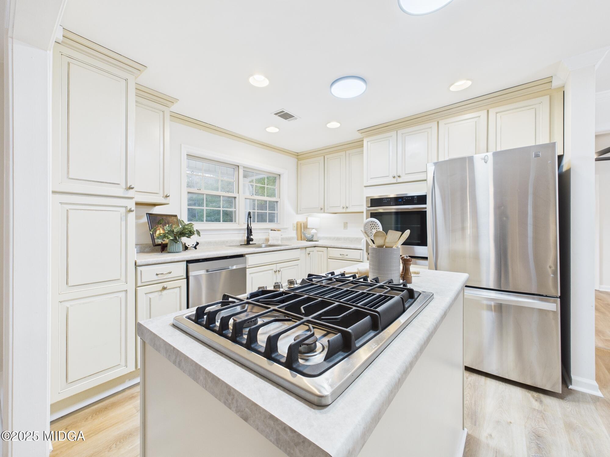 331 Marjane Drive Macon, GA 31210 - Photo 14 of 43 a kitchen with stainless steel appliances granite countertop a stove a refrigerator and a refrigerator