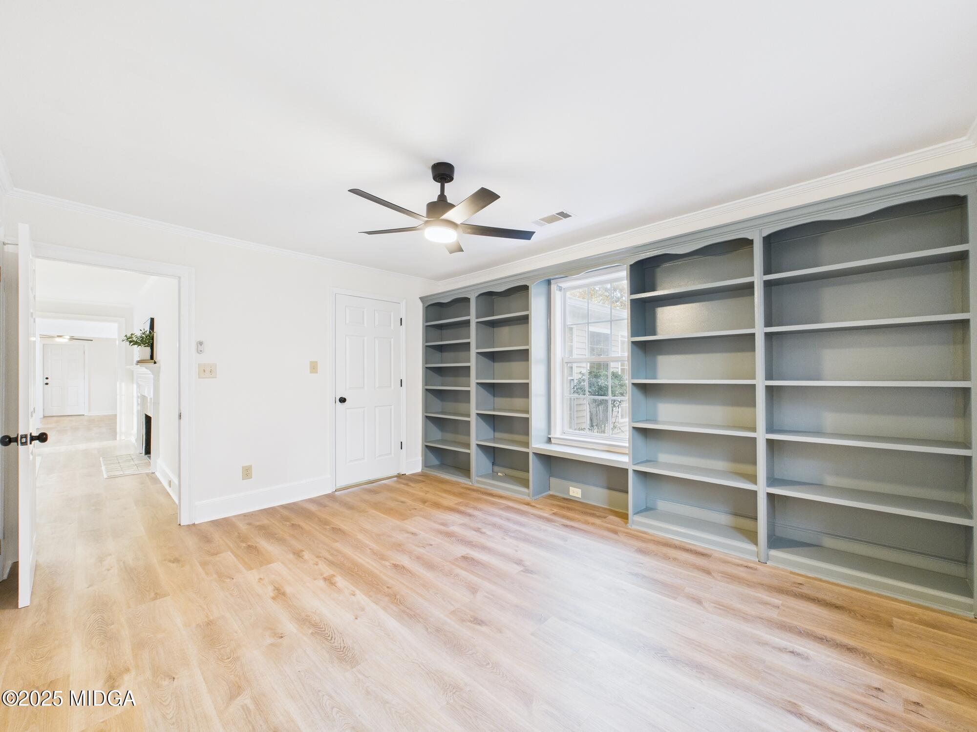 331 Marjane Drive Macon, GA 31210 - Photo 22 of 43 a view of an empty room with a window and wooden floor