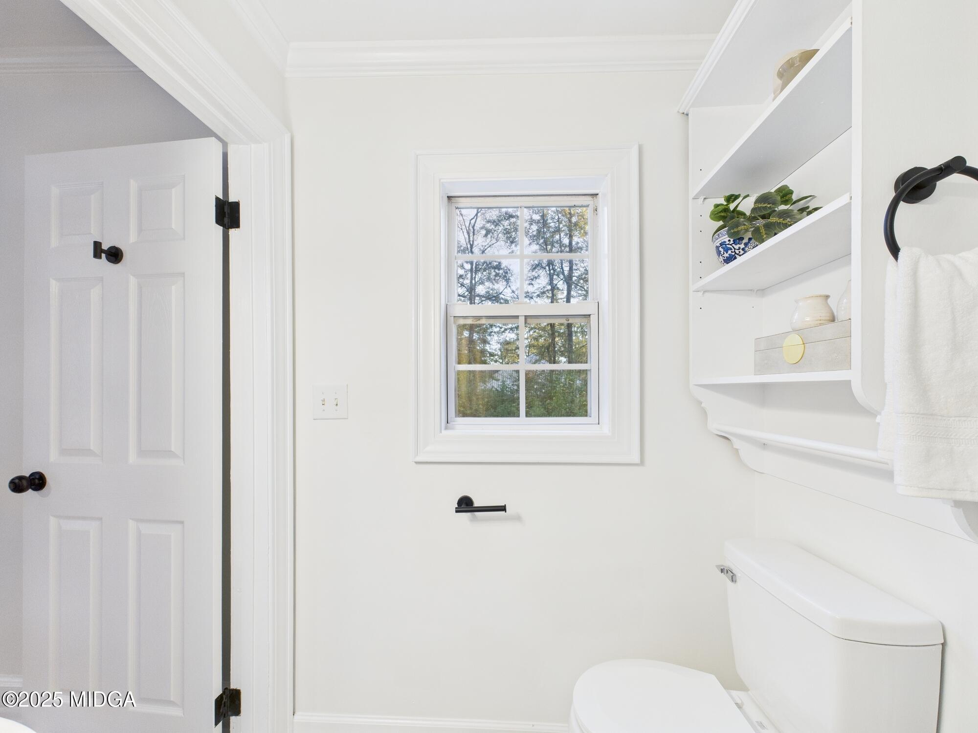 331 Marjane Drive Macon, GA 31210 - Photo 24 of 43 a bathroom with a toilet shower and window