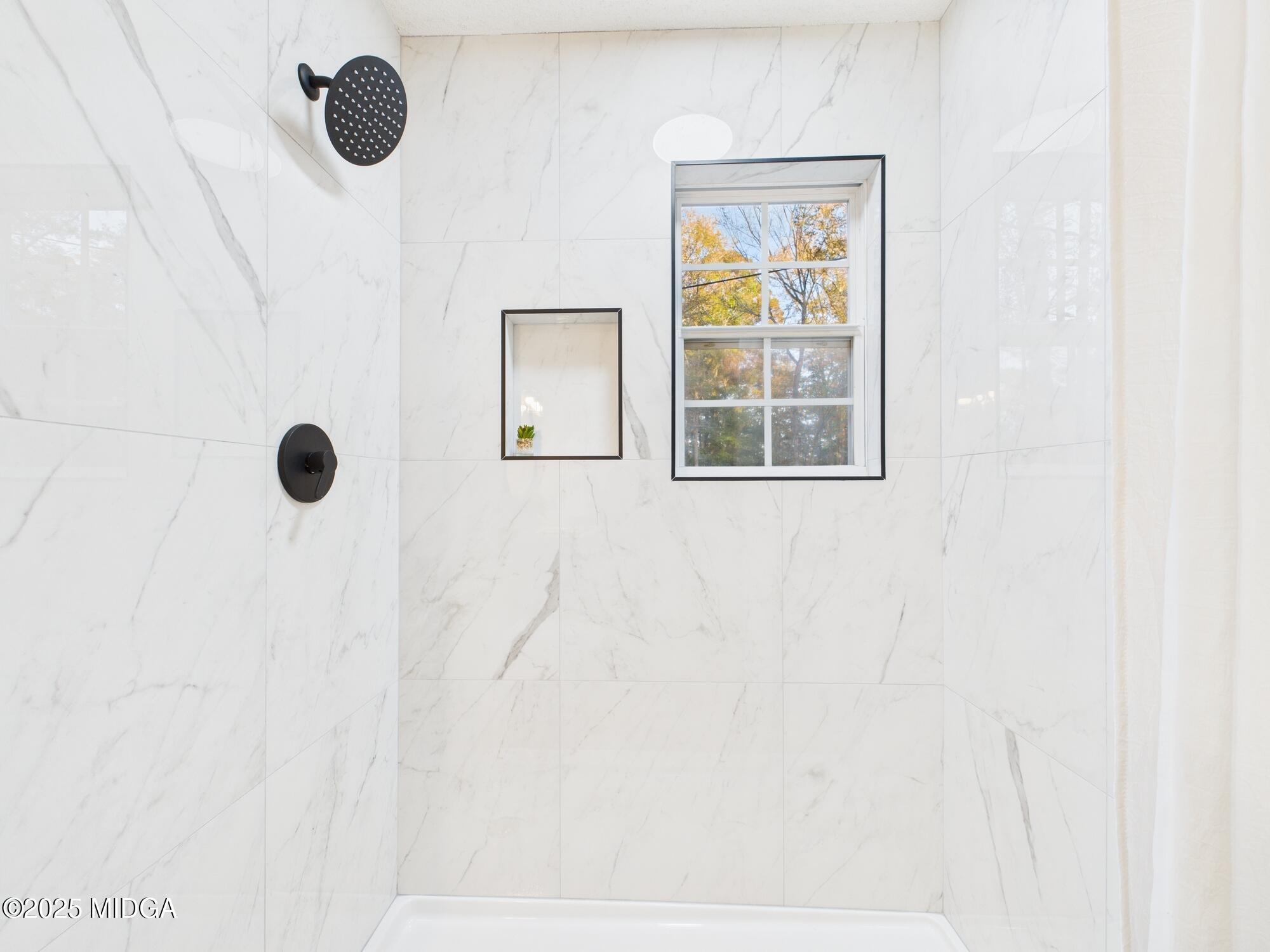 331 Marjane Drive Macon, GA 31210 - Photo 32 of 43 a bathroom with a window and a shower