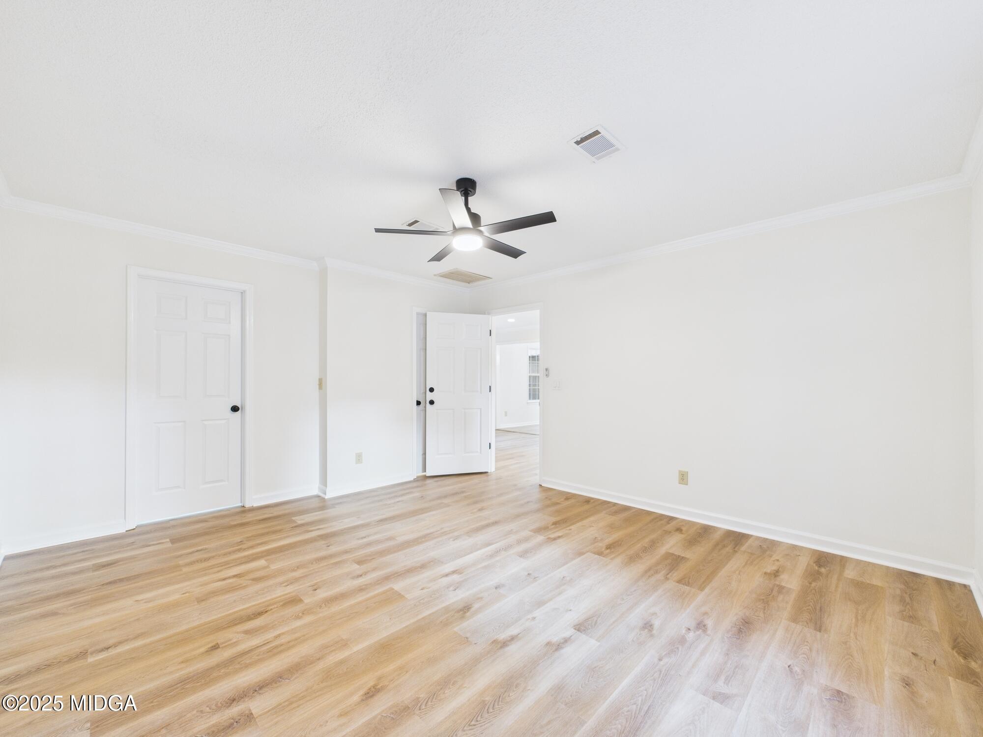 331 Marjane Drive Macon, GA 31210 - Photo 34 of 43 a view of a room with wooden floor and a ceiling fan