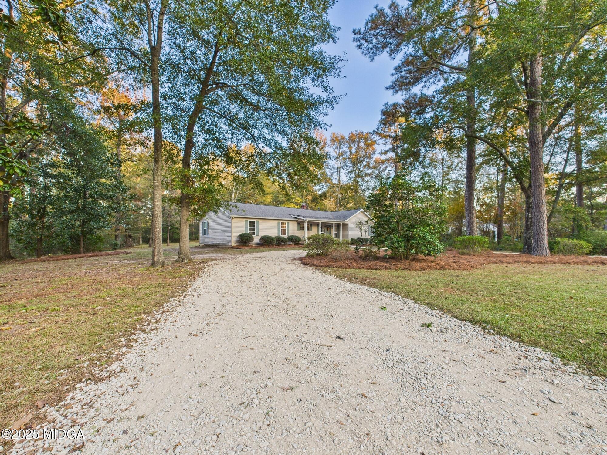 331 Marjane Drive Macon, GA 31210 - Photo 42 of 43 a house with trees in front of it