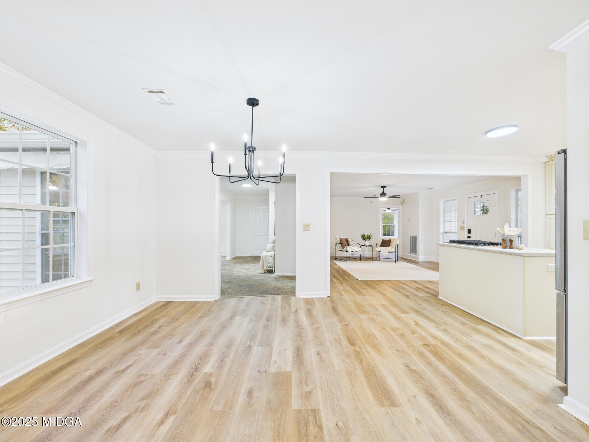 331 Marjane Drive Macon, GA 31210 - Photo 9 of 43 a view of a kitchen with wooden floor and windows