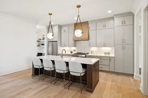 a kitchen with a sink and a window